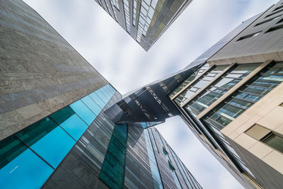 Low angle view of modern buildings against sky