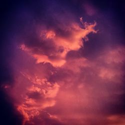 Low angle view of cloudy sky at sunset