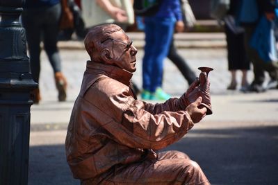 Low angle view of life statue against bird