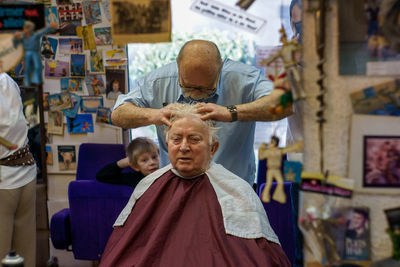 Portrait of happy boy sitting in market