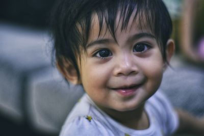 Close-up portrait of cute baby boy at home