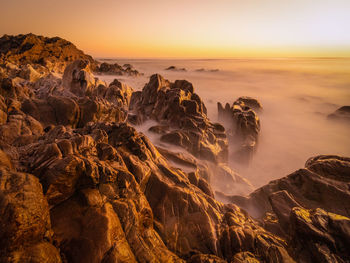 Scenic view of sea against sky during sunset