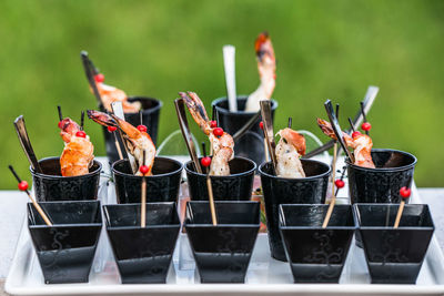 Food arranged in containers on tray