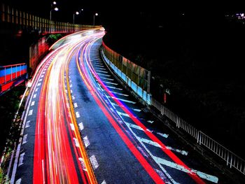 High angle view of light trails on road at night