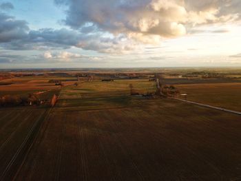 Scenic view of field against sky during sunset