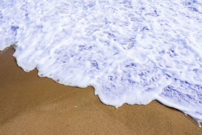 High angle view of surf on beach