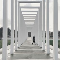 Full length of woman walking on footbridge