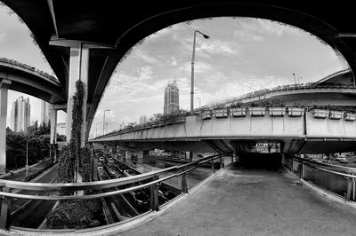 View of bridge against cloudy sky