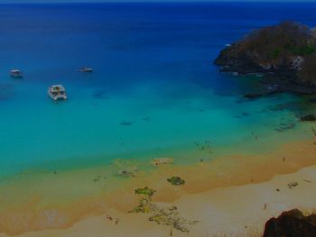 High angle view of boats in calm blue sea