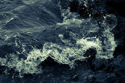Waves splashing on rocks
