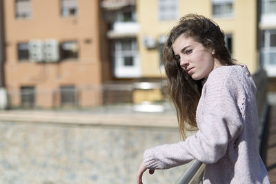 Young woman standing in city