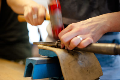 Close-up of man working on cutting board