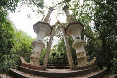 Low angle view of statue against trees