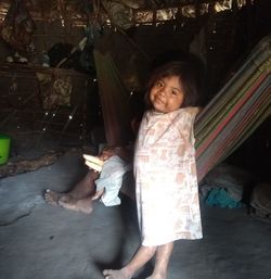 Portrait of smiling girl standing on outdoors