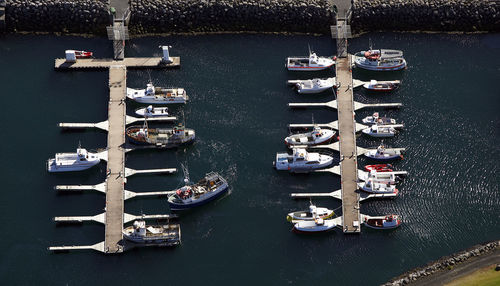Aerial shot of small fishing boats in the harbour of keflavik