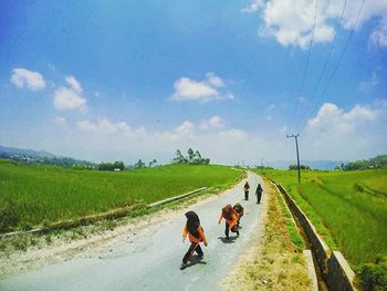 Road passing through field