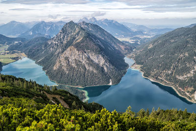 Panoramic view of lake and mountains against sky