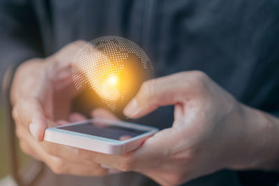 Close-up of person using mobile phone