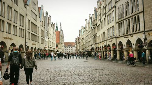 People walking on street in city