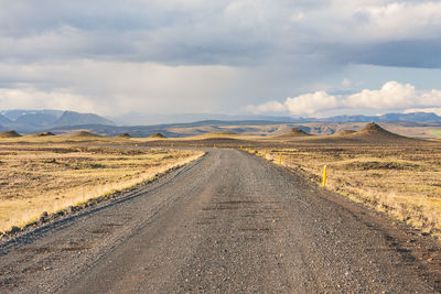 Road amidst landscape against sky