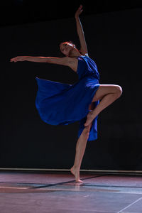 Young woman dancing on stage