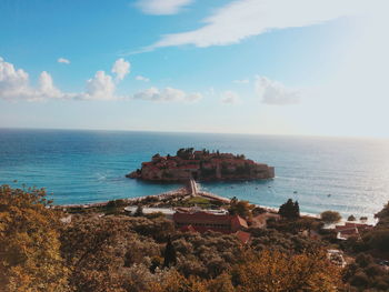 High angle view of sea and buildings against sky