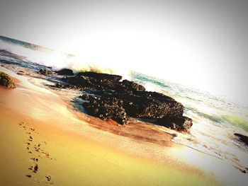Scenic view of beach against sky