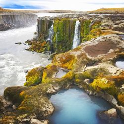 Scenic view of waterfall at beach