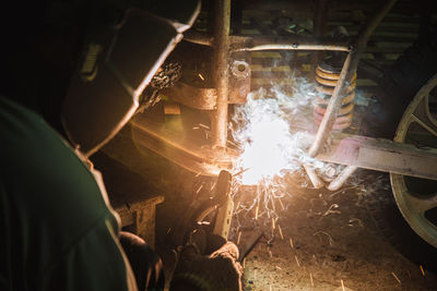 People working on metal structure