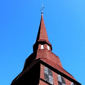Low angle view of building against blue sky