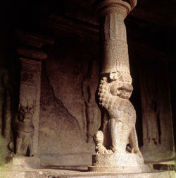 Statue in front of historic temple