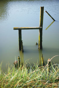 High angle view of wooden post in lake