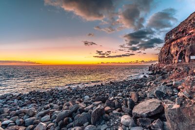 Scenic view of sea against sky during sunset