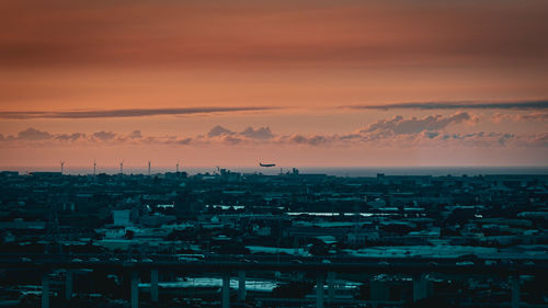 High angle view of cityscape against sky during sunset