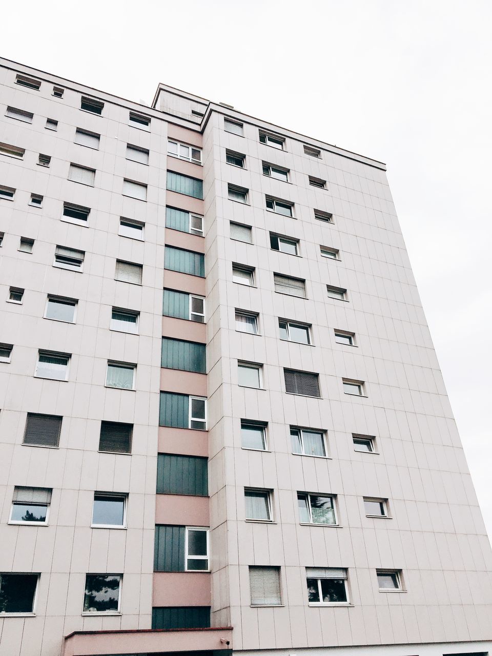 built structure, building exterior, architecture, low angle view, window, sky, building, city, no people, repetition, day, modern, in a row, office building exterior, office, glass - material, tall - high, outdoors, nature, pattern, skyscraper, apartment