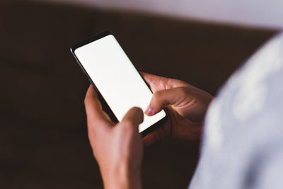 Close-up of person using mobile phone