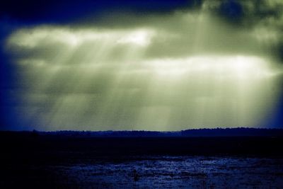 Scenic view of landscape against sky at night