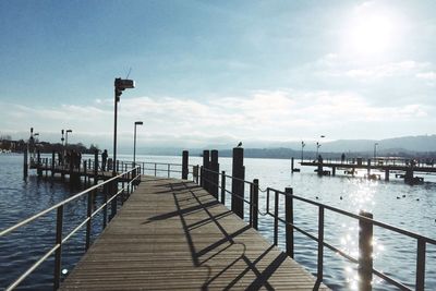 Pier on sea against sky