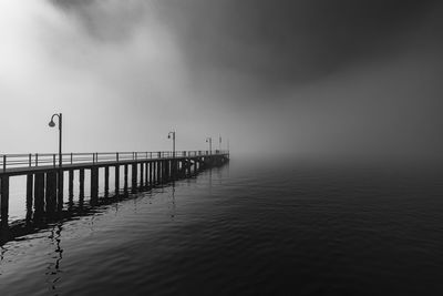 Pier on sea against sky