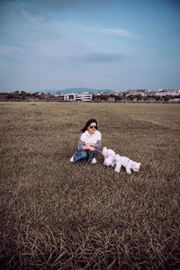 Portrait of woman with dogs on land