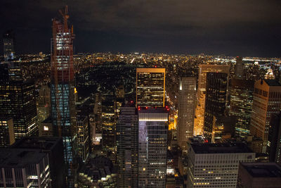 High angle view of illuminated buildings in city at night