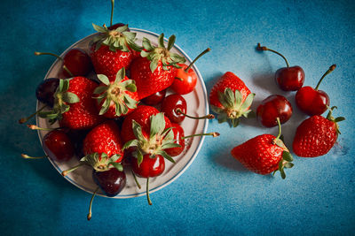 High angle view of strawberries on table