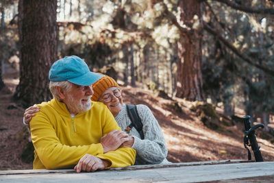 Portrait of senior woman sitting in forest