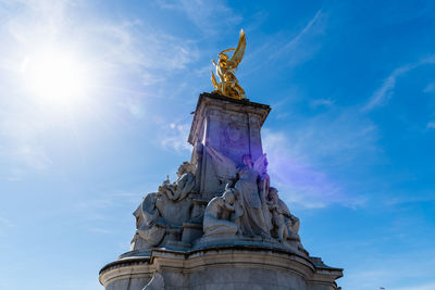 Low angle view of statue against cloudy sky