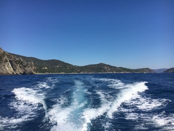 Scenic view of sea against blue sky