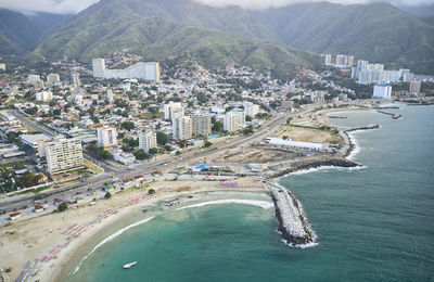 High angle view of townscape by sea