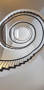 Low angle view of spiral staircase in building