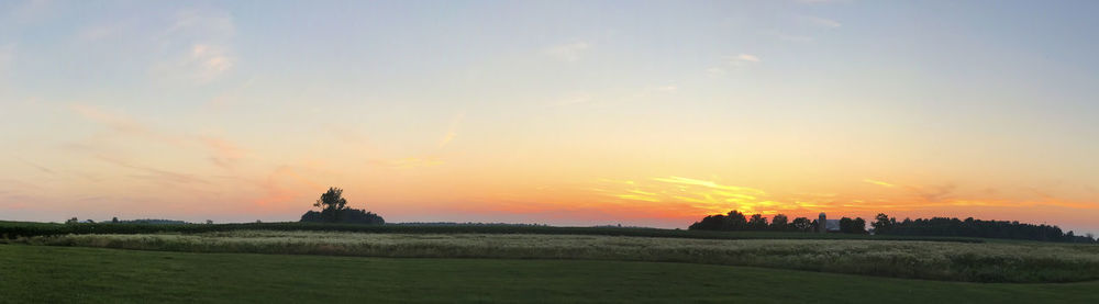 Scenic view of sunset over land