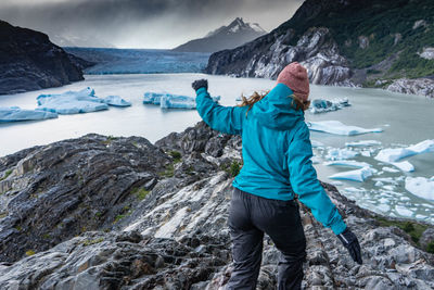 Glaciar grey, patagonia chilena. rear view of person on snowcapped mountains during winter