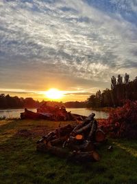 Scenic view of field against sky during sunset